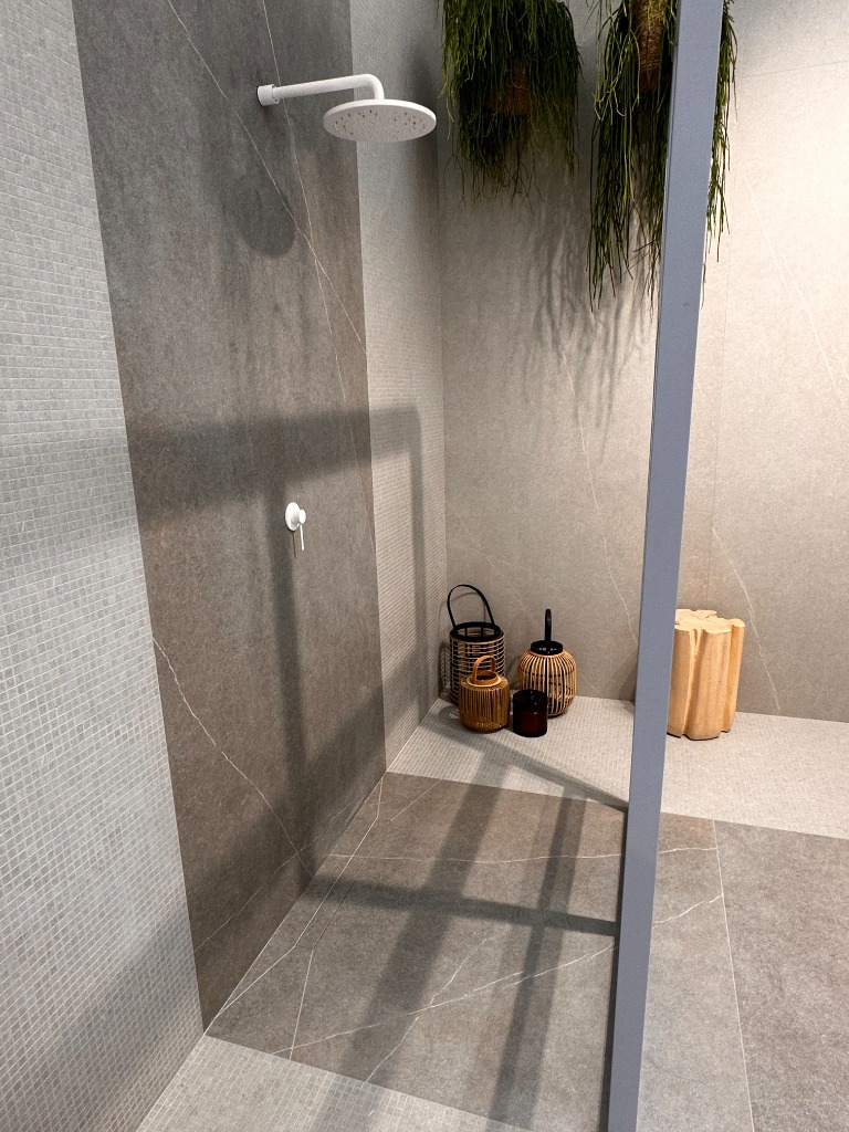 Douche à l'italienne haut de gamme avec carrelage mural grand format sans joints apparents